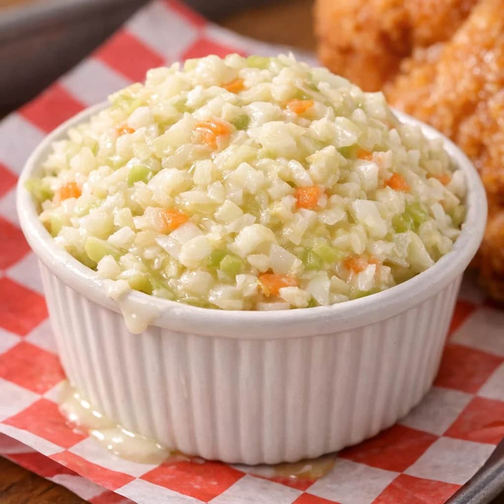KFC (Kentucky Fried Chicken) Coleslaw Copycat - A creamy, sweet-and-tangy coleslaw that closely mimics the original KFC recipe. Adapted from Top Secret Recipes, it makes enough to serve a crowd as a classic side dish.